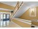 Well-lit interior stairwell with wood railings and white risers providing a classic and elegant design in the building at 2810 Bedford Green Dr # 300, Raleigh, NC 27604