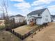 View of the backyard with a fence, wooden deck, and some trees at 2981 Thurman Dairy Loop, Wake Forest, NC 27587