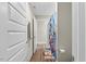 Hall bathroom featuring wood-look floors and colorful shower curtain at 2981 Thurman Dairy Loop, Wake Forest, NC 27587