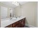 Bathroom featuring double sinks, vanity, and decorative mirror at 2981 Thurman Dairy Loop, Wake Forest, NC 27587
