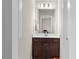 Powder room with modern vanity and decorative mirror at 2981 Thurman Dairy Loop, Wake Forest, NC 27587
