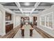 Elegant dining room featuring coffered ceilings, hardwood floors, and open floor plan at 2981 Thurman Dairy Loop, Wake Forest, NC 27587