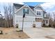 Charming two-story home featuring a two-car garage and a basketball hoop on the driveway at 2981 Thurman Dairy Loop, Wake Forest, NC 27587