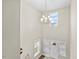 Light-filled foyer with a chandelier, neutral walls, and staircase, creating a welcoming entrance at 2981 Thurman Dairy Loop, Wake Forest, NC 27587