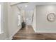 Welcoming foyer with hardwood floors, a decorative table, and an open view of the staircase at 2981 Thurman Dairy Loop, Wake Forest, NC 27587