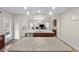Spacious kitchen with granite counters, stainless steel appliances, and open layout to the living room at 2981 Thurman Dairy Loop, Wake Forest, NC 27587