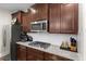 Modern kitchen featuring granite countertops, stainless steel appliances, and custom cabinets at 2981 Thurman Dairy Loop, Wake Forest, NC 27587