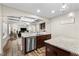 Open-concept kitchen with stainless steel appliances and granite countertops overlooks the living area at 2981 Thurman Dairy Loop, Wake Forest, NC 27587