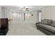 Spacious living room offers neutral tones, ceiling fan, and ample natural light at 2981 Thurman Dairy Loop, Wake Forest, NC 27587