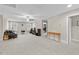 Living room featuring neutral tones, ceiling fan, and multiple windows for natural light at 2981 Thurman Dairy Loop, Wake Forest, NC 27587