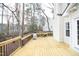 Newly constructed wooden deck with black railing overlooks the backyard, offering a great outdoor space at 3010 Shopton Dr, Apex, NC 27502