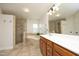 Primary bathroom suite features a glass shower, soaking tub, and vanity with a large mirror at 3010 Shopton Dr, Apex, NC 27502