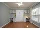 Versatile bedroom with a built-in Murphy bed and dual workstation desks at 3010 Shopton Dr, Apex, NC 27502