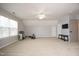 Large bonus room with carpet, a ceiling fan, gym equipment, and a view of the backyard at 3010 Shopton Dr, Apex, NC 27502