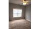 Standard bedroom with neutral walls and a ceiling fan at 3123 Hudson Hill Ln, Raleigh, NC 27612