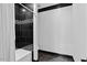 Modern bathroom features a black tiled shower with glass door and mosaic accents at 318 W Lillington St, Angier, NC 27501
