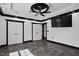 A large primary bedroom with tray ceilings, neutral walls, and double-door closets at 318 W Lillington St, Angier, NC 27501