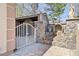 Gated stone patio with a fountain and statues for a peaceful outdoor living space at 318 W Lillington St, Angier, NC 27501