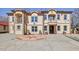 Stately two-story home with multiple balconies, decorative ironwork, and circular driveway at 318 W Lillington St, Angier, NC 27501