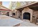 Covered stone outdoor kitchen with built-in grill and ample counter space, great for entertaining at 318 W Lillington St, Angier, NC 27501