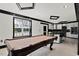 Recreation space featuring a pool table, recessed lighting and access to the kitchen at 318 W Lillington St, Angier, NC 27501