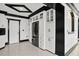 Kitchen area featuring a refrigerator, plenty of cabinet space, and modern black trim at 318 W Lillington St, Angier, NC 27501