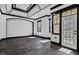 Bright living room featuring a unique tray ceiling, neutral walls and access to the outdoor patio at 318 W Lillington St, Angier, NC 27501
