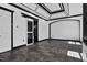 Open-concept living room featuring modern finishes, neutral walls, and access to the bathroom at 318 W Lillington St, Angier, NC 27501