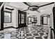 Open-concept living area showcasing a geometric tile floor and distinctive black trim at 318 W Lillington St, Angier, NC 27501