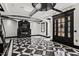 Striking living room boasts a black and white checkered floor and decorative ceiling at 318 W Lillington St, Angier, NC 27501