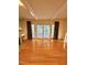 Light-filled living room with hardwood floors and patio access at 325 Old Salem Rd, Roxboro, NC 27573