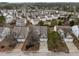 Aerial view of a well-planned community showcasing neat homes with driveways and manicured lawns at 401 Euphoria Cir, Cary, NC 27519