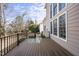 Back deck overlooking the back yard with beige siding and window accents along the house at 405 Chandler Grant Dr, Cary, NC 27519