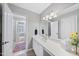 Bathroom featuring a vanity with a large mirror and natural light at 405 Chandler Grant Dr, Cary, NC 27519