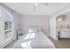 Bright bedroom with an arched window and an ensuite bathroom at 405 Chandler Grant Dr, Cary, NC 27519