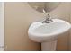 Pedestal sink in a cozy bathroom at 4909 Jelynn St, Raleigh, NC 27616