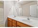 Bathroom features a double sink vanity with lots of cabinet space, and a large mirror at 4909 Jelynn St, Raleigh, NC 27616