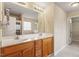 Bathroom featuring a double sink vanity, a large mirror, and a separate shower and tub at 4909 Jelynn St, Raleigh, NC 27616