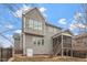 Back of a two-story home with a screened porch, and fenced in back yard at 4909 Jelynn St, Raleigh, NC 27616