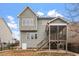 Back exterior of home featuring a screened porch, stairs and fenced-in yard at 4909 Jelynn St, Raleigh, NC 27616
