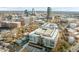 Apartment building with rooftop parking and city skyline backdrop at 500 N Duke St # 55-103, Durham, NC 27701