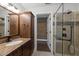 Elegant primary bathroom featuring vanity with granite countertop, large walk-in shower, and tiled flooring at 500 N Duke St # 55-103, Durham, NC 27701