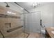 The primary bathroom boasts a glass-enclosed shower, modern fixtures, and tile flooring at 500 N Duke St # 55-103, Durham, NC 27701