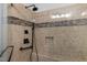 Beautifully tiled walk-in shower featuring modern fixtures and neutral color palette at 500 N Duke St # 55-103, Durham, NC 27701