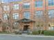 Elegant brick building entrance featuring covered entryway and well-maintained landscaping at 500 N Duke St # 55-103, Durham, NC 27701