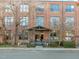 Brick exterior of building 55 with metal awning, street parking, and mature landscaping at 500 N Duke St # 55-103, Durham, NC 27701