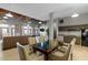 Spacious common area with kitchen, dining table, living area, and exposed brick and ceilings at 500 N Duke St # 55-103, Durham, NC 27701