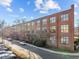 Exterior of a brick building with large windows under a blue sky at 500 N Duke St # 55-103, Durham, NC 27701