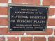 Close-up of a National Register of Historic Places plaque on a brick building at 500 N Duke St # 55-103, Durham, NC 27701