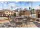 Outdoor patio area with a metal table set on a wooden deck with city views in the distance at 500 N Duke St # 55-103, Durham, NC 27701
